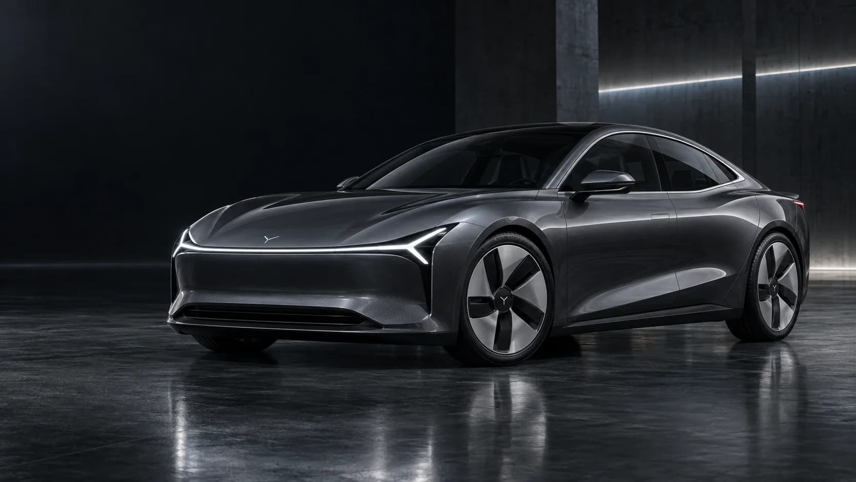 Dyntree M1E graphite electric coupe development prototype in a dark architectural studio